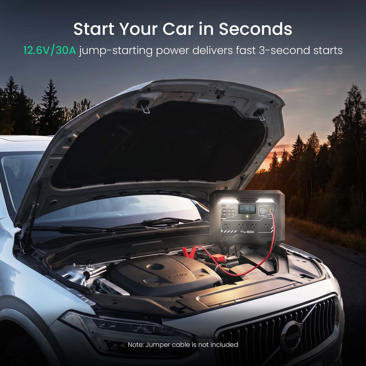 A car jump starter device shown in a real outdoor setting with a car hood open at sunset, with marketing text at the top and a note that the jumper cable is not included.